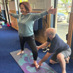 Lena with Brian doing yoga